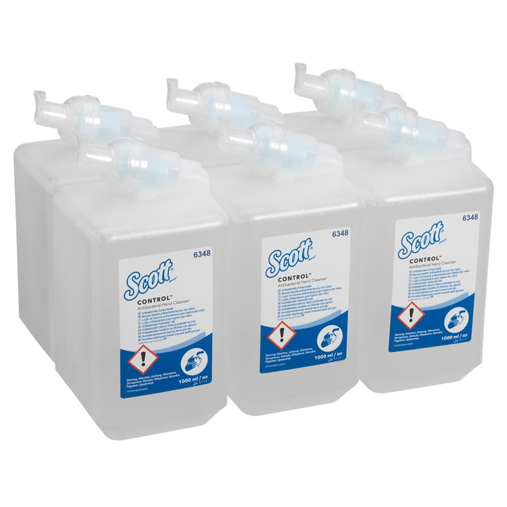 A Stack of Six Clear, White and Blue 6348 Scott Control Hand Sanitiser Refills
