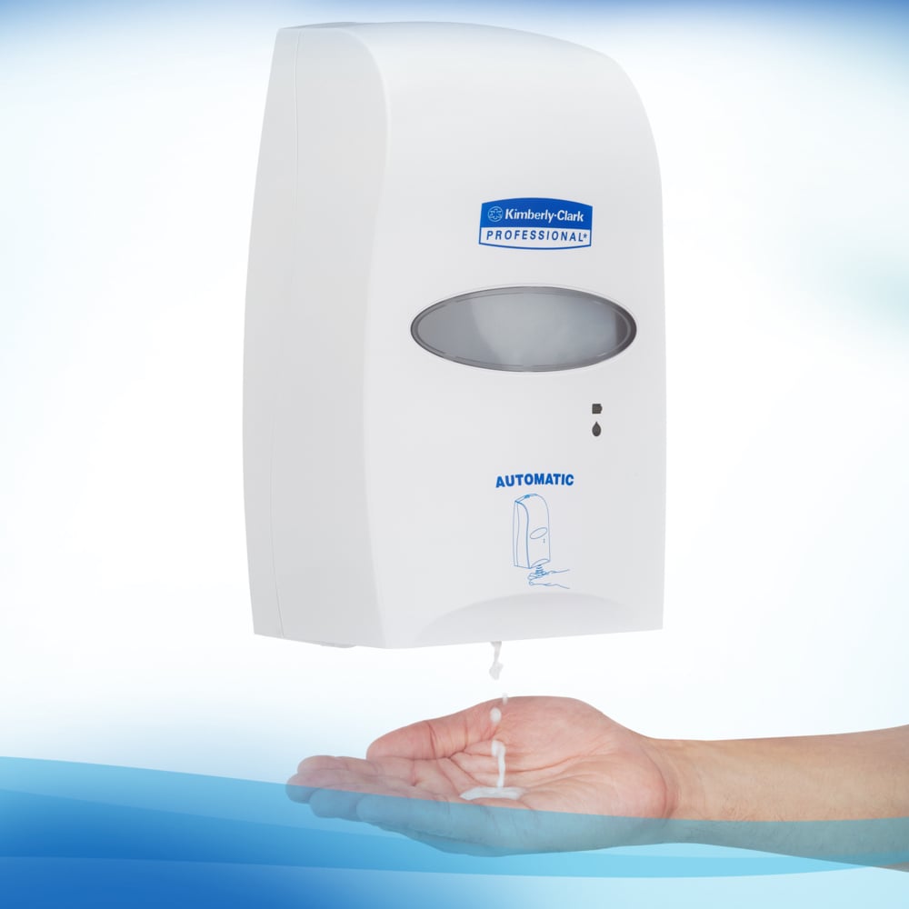 A Person Using a White and Blue Kimberly-Clark 6393 Automatic Hand Sanitiser Dispenser