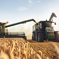Image of a combine harvester collecting wheat