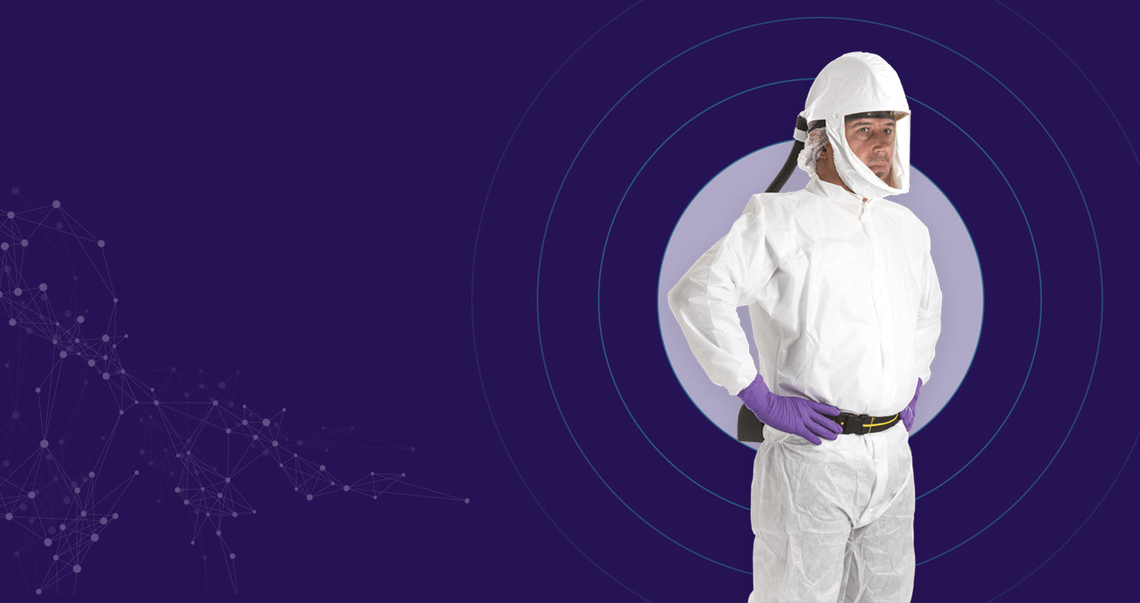 Purple Background with a man wearing a disposable coverall and powered respirator