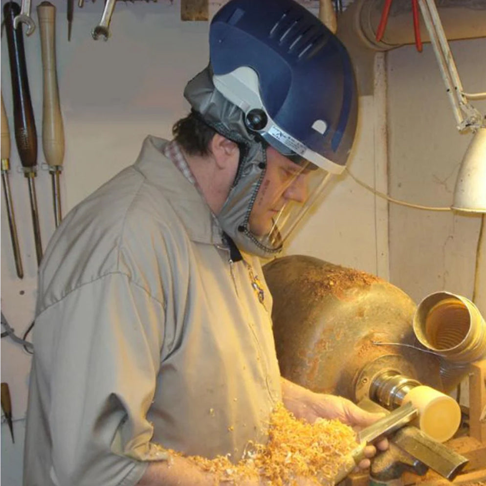 A woodworker wearing a PureFlo Xstream Powered Respirator | Sentinel Laboratories Ltd