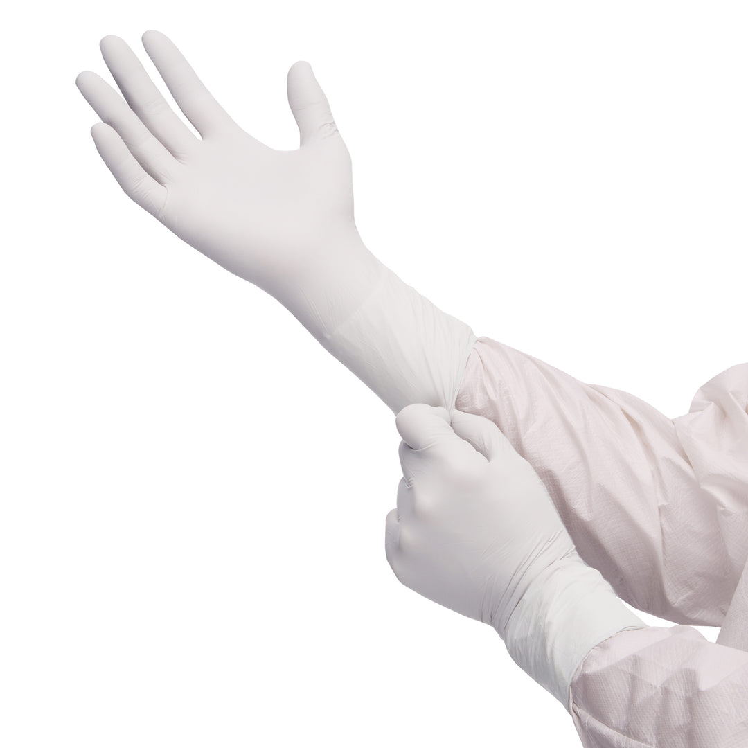 A Person in a White Coverall Donning a Pair of 56888 G3 Sterile White Nitrile Gloves