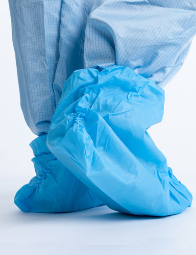 A Person in a Blue Coverall Wearing a Pair of Blue Ansell BioClean Durableu Disposable Overboots BDBL