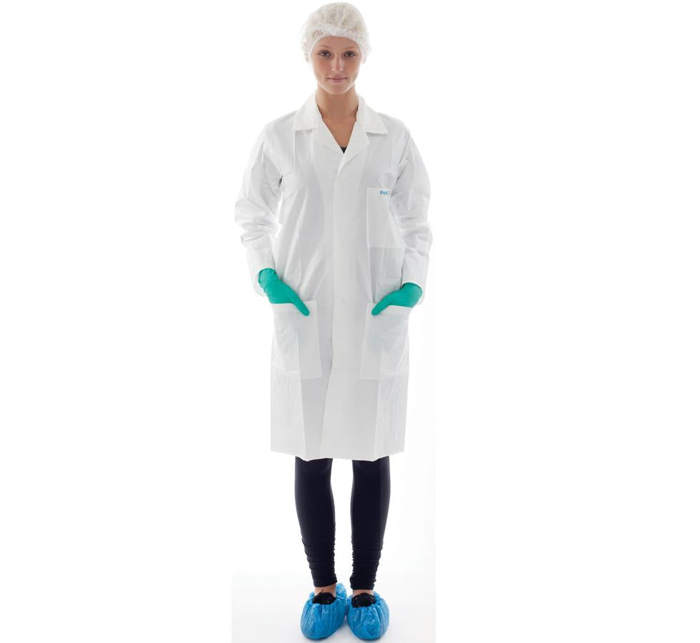Woman wearing White BioClean-D™ Sterile Disposable Laboratory Coat with Green Gloves and Blue Overshoes - Sentinel Laboratories Ltd
