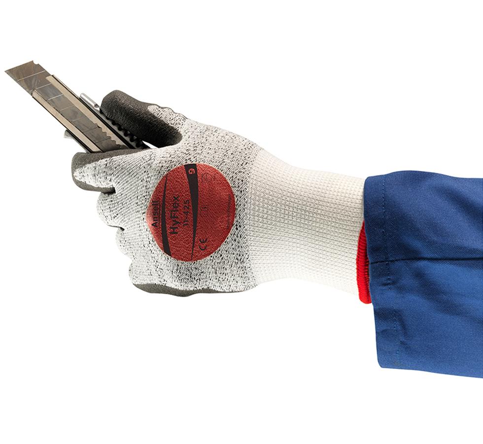 Man Wearing Grey, White and Red HYFLEX® 11-425 (Previously Puretough™ P5000) Gloves Holding a Metal Box-Cutter - Sentinel Laboratories Ltd