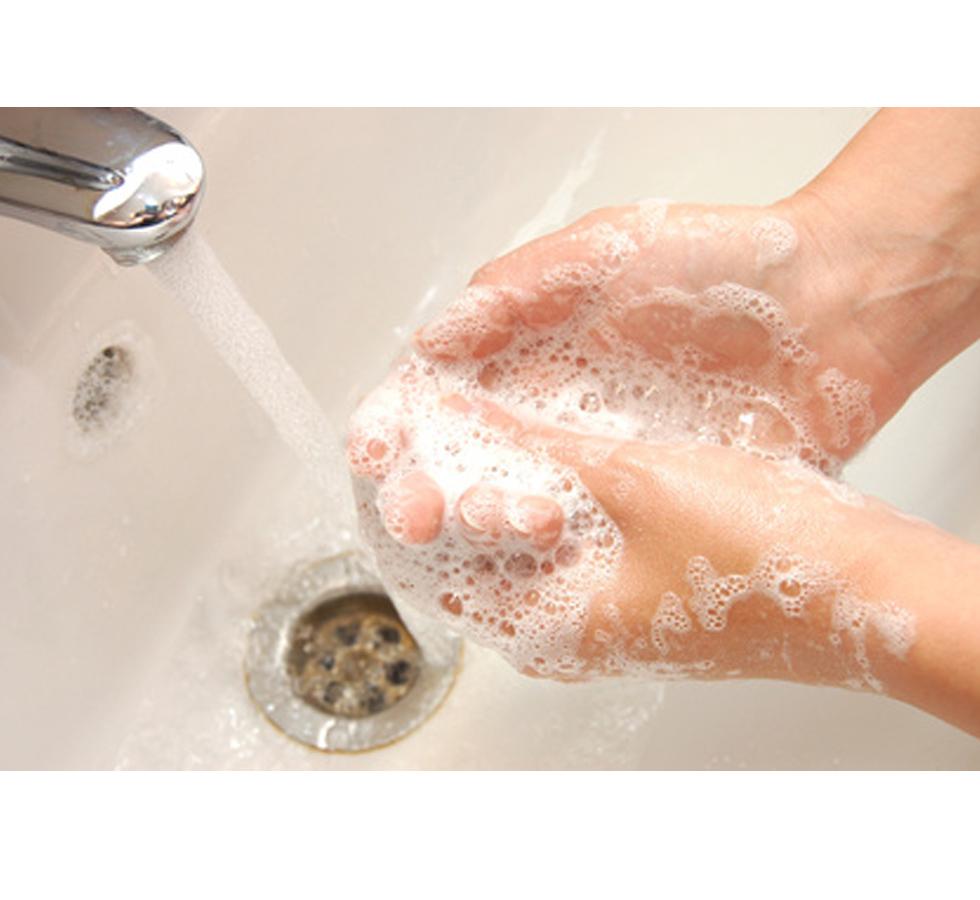 Person washing hands with soap under sink - Infection Control Training - Level 2 - Sentinel Laboratories Ltd