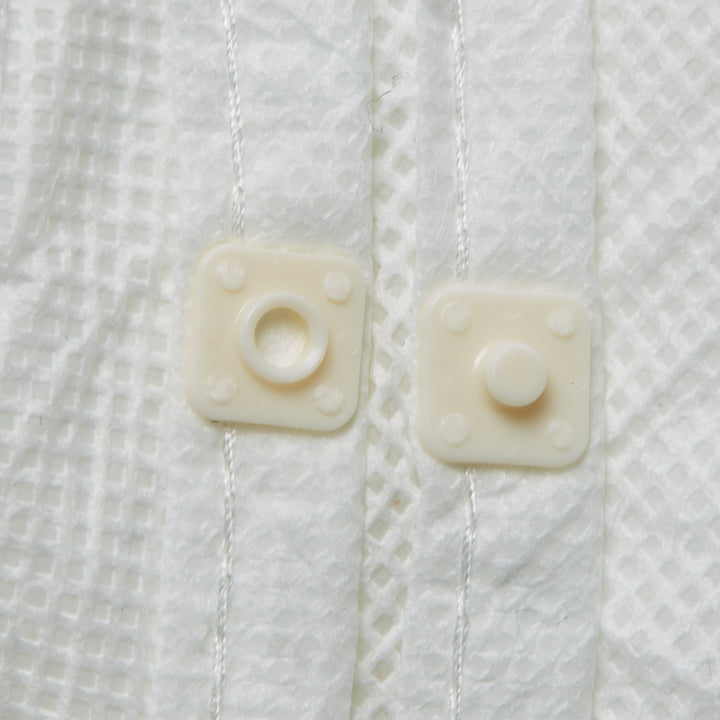 A Close Up of the Buttons on a White KIMTECH* A5 Sterile Cleanroom Coverall - Sentinel Laboratories Ltd
