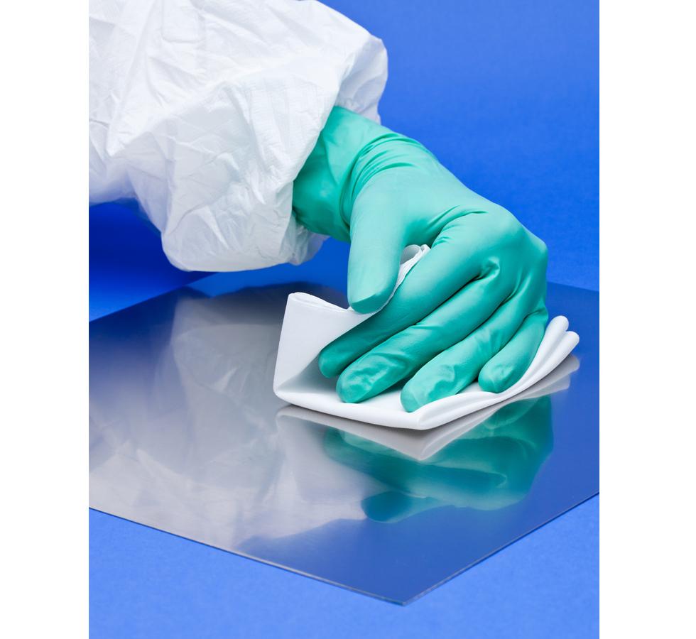 Gloved Hand wiping Blue Surface Mat using White BioClean IsoPure Plus™ Sterile Wipes - Sentinel Laboratories Ltd