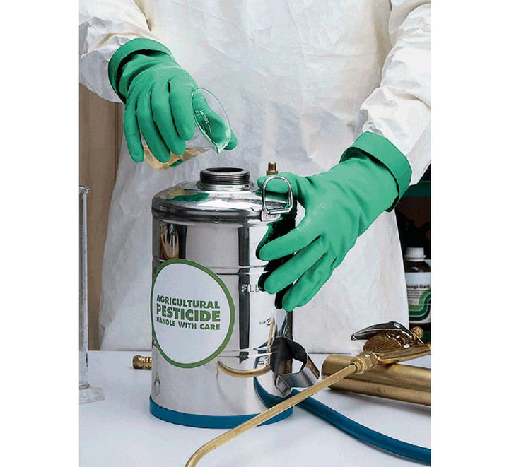 A Person In a White Lab Coat Wearing a Pair of Green Folded Cuff Showa Best 730 Nitri-Solve® Nitrile Long Length Cuff Gloves Pouring Pesticide into a Pesticide Container - Flock Lined 0,38mm thick, 330mm long - Sentinel Laboratories Ltd