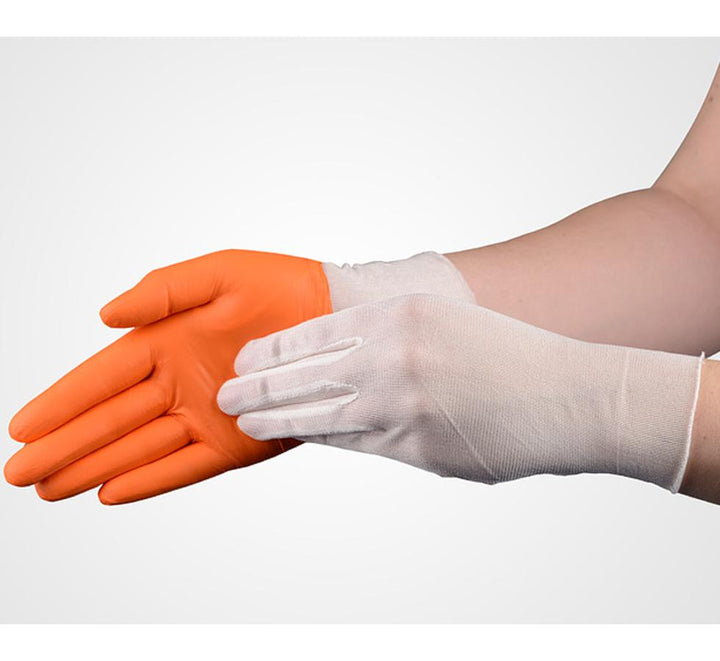 A Person Wearing a Pair of White SENSI-TOUCH® Silk Glove Liners, Long Length Donning an Orange Glove - Sentinel Laboratories Ltd