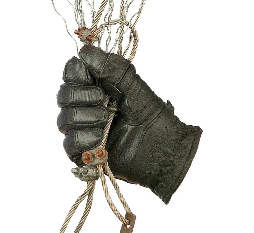 A Single All Black TurtleSkin® Utility Glove Holding an Assortment of Metal Wires - Sentinel Laboratories Ltd
