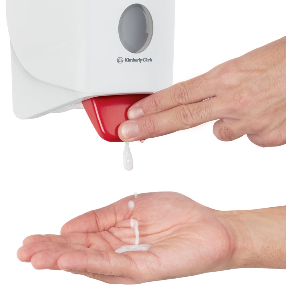 A Person Using a White and Red Kimberly-Clark 6392 Hand Sanitiser Dispenser