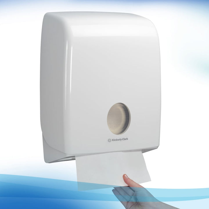 A Person Using a Single 6636 White Paper Hand Towel Dispenser
