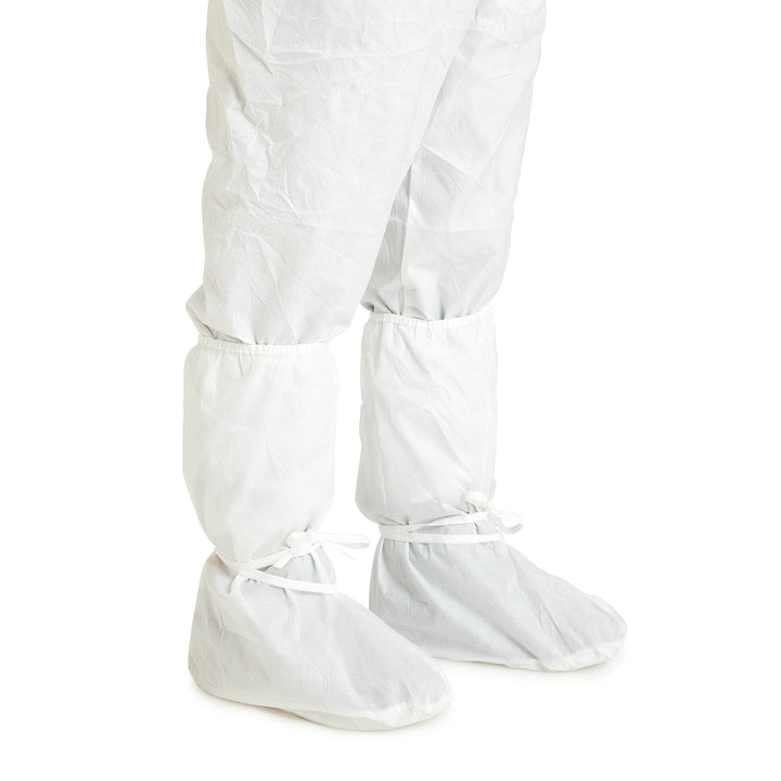 A Person Wearing White 31683/31696 KIMTECH* A5 Sterile Boots Over a White Coverall - Vinyl Foot - Sentinel Laboratories Ltd