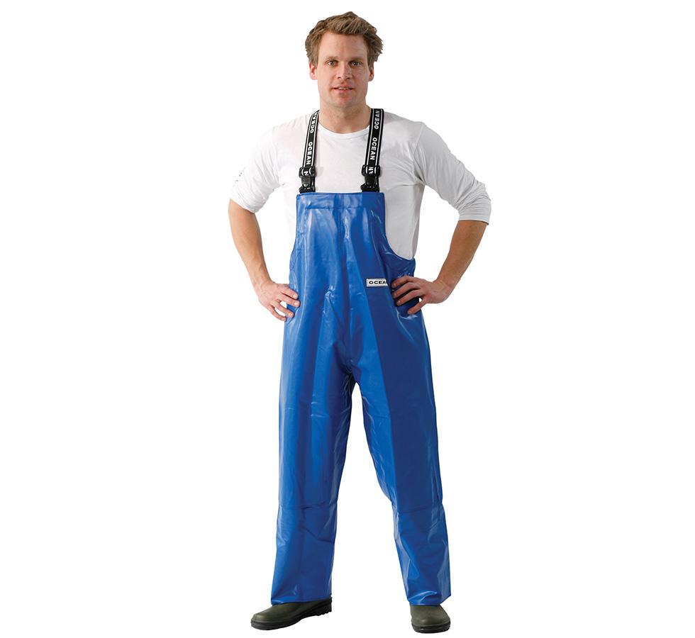 A Man Wearing a Blue Ocean Forest Bib & Brace Trousers (with knee reinforcement) and White Long-Sleeved Shirt Rolled Up to His Elbows - Sentinel Laboratories Ltd