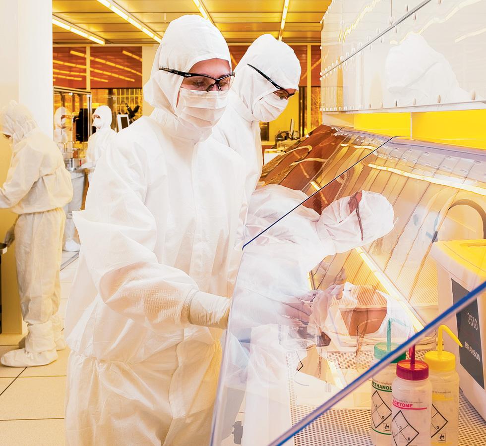 A Group of People Wearing White Lab Coveralls, 62465 KIMTECH PURE* M3 Non-Sterile Pleated Face Masks w/Earloops, 18cm in a Yellow Lab - Sentinel Laboratories Ltd