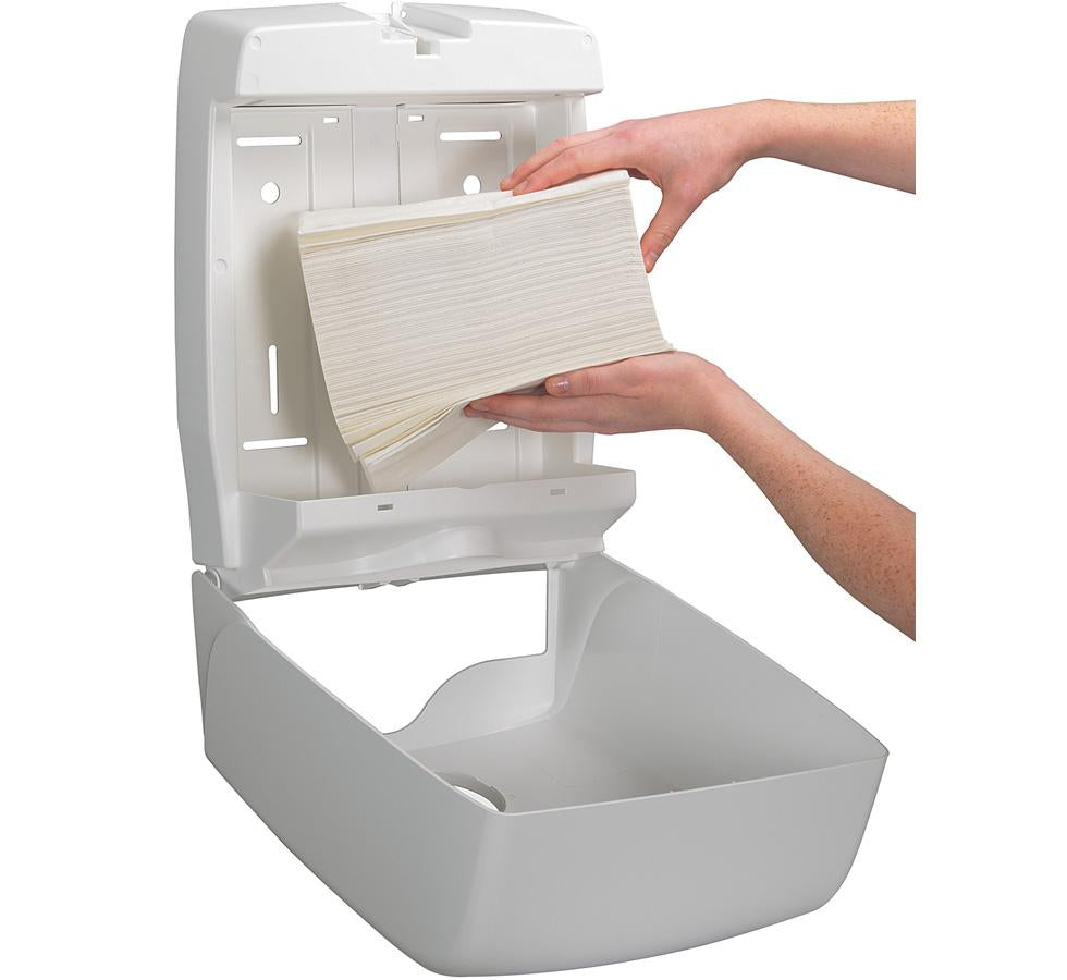 A Person Using a White Open Paper 6954 AQUARIUS* Folded Hand Towel Dispenser, C Fold - White - Sentinel Laboratories Ltd