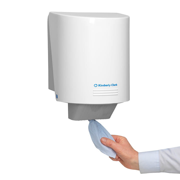 Person Taking a Blue Piece of Paper from a White and Grey 7277 WYPALL* L20 ESSENTIAL Wiper Dispenser - CENTREFEED ROLL, BLUE, 6 ROLLS - Sentinel Laboratories Ltd