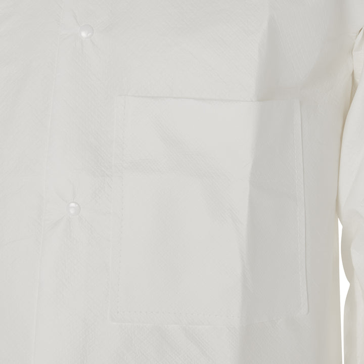 A Close-Up View of a Person Wearing a 97700 White Coverall, Chest Pocket