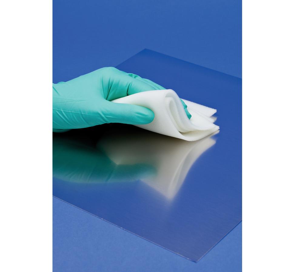 Gloved Hand wiping Blue Surface Mat using White BioClean Isorba™ Wipes - Sentinel Laboratories Ltd