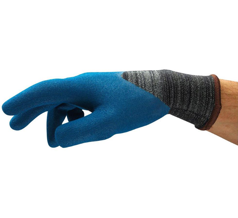 A Man Wearing a Single Dark Grey and Blue HYFLEX® 11-947 (Previously Nitrotough™ N3500) Glove with Brown Beaded Cuff - Sentinel Laboratories Ltd