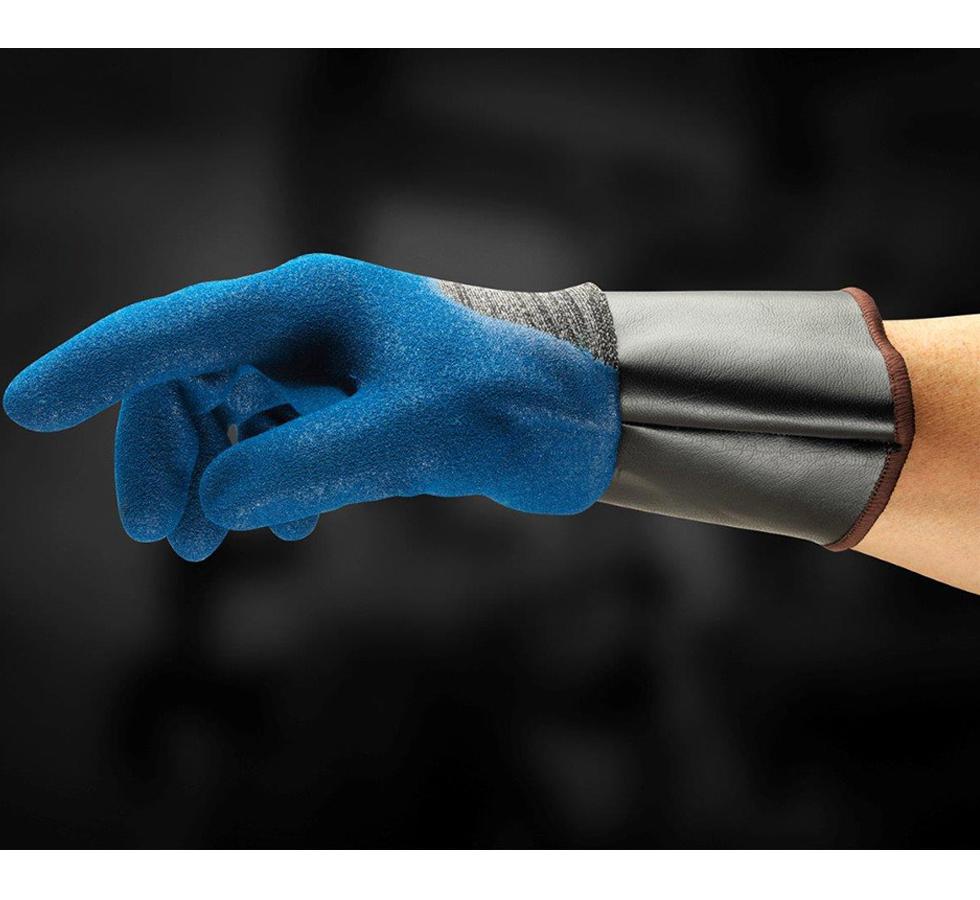 A Man Wearing a Single Black and Blue HYFLEX® 11-948 (Previously Nitrotough™ N3500 SC) Glove with a Long Black, Brown Beaded Cuff - Sentinel Laboratories Ltd
