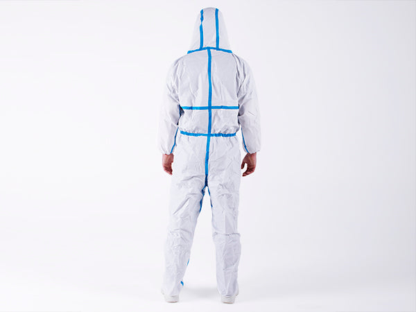 A Man Wearing a White OTCH4 BioClean Omega Coverall with Hood and Blue Taped Seams