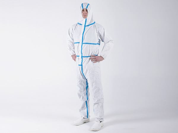 A Man Wearing a White OTCH4 BioClean Omega Coverall with Hood and Blue Taped Seams