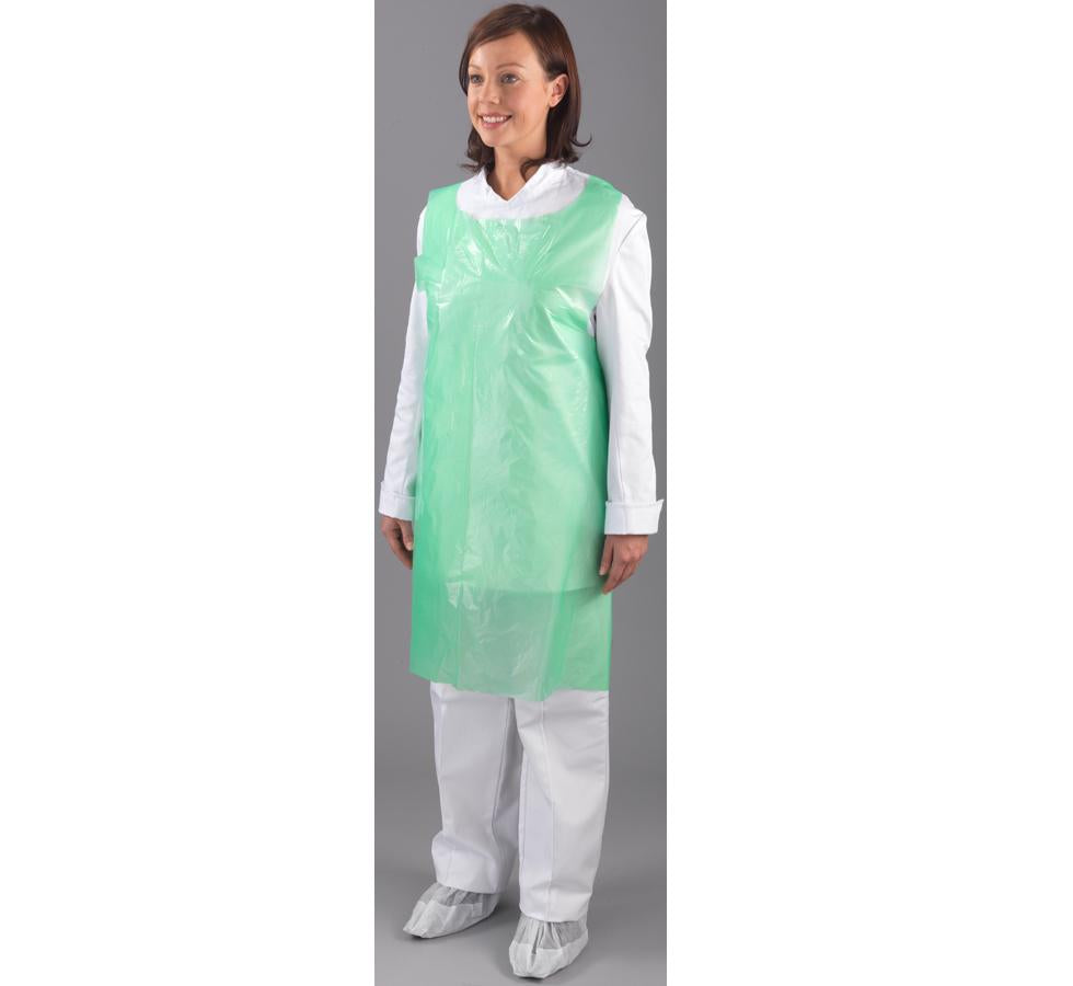A Woman Wearing a Green Shield 69 x 107cm Polythene Apron Over a White Coverall and Overshoes - Sentinel Laboratories Ltd