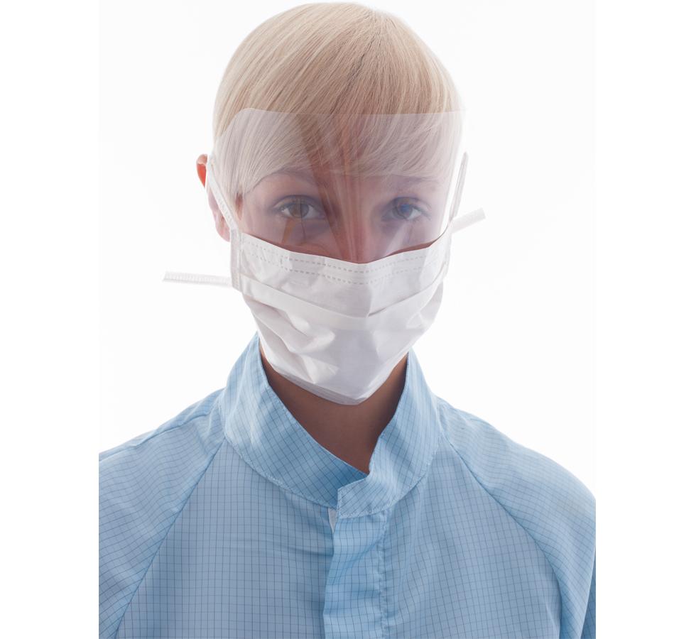 Woman wearing a white BioClean Clearview™ Looped Visor Facemask with Blue Gown - Sentinel Laboratories Ltd